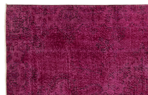 Load image 1 in gallery view. Magenta distressed rug with a faded traditional floral medallion pattern on a white background.
