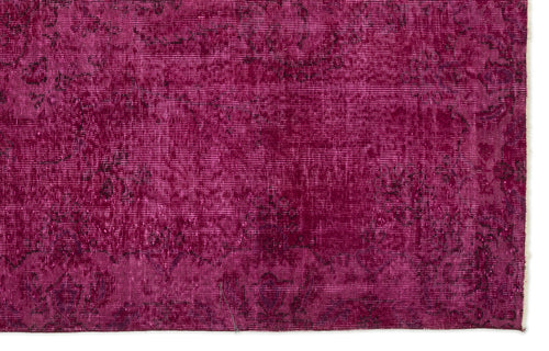 Load image 1 in gallery view. Magenta overdyed vintage rug with a distressed, faded traditional floral pattern.