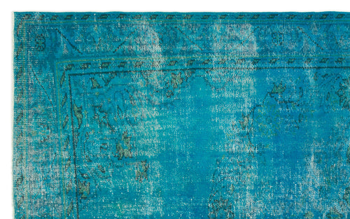 Load image 1 in gallery view. Bright turquoise distressed rug with a faded traditional border and central medallion pattern.