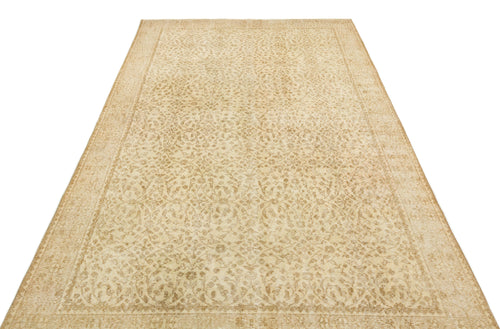 Load image 1 in gallery view. Beige and tan vintage-style rug with an intricate, faded floral medallion pattern and a bordered edge.