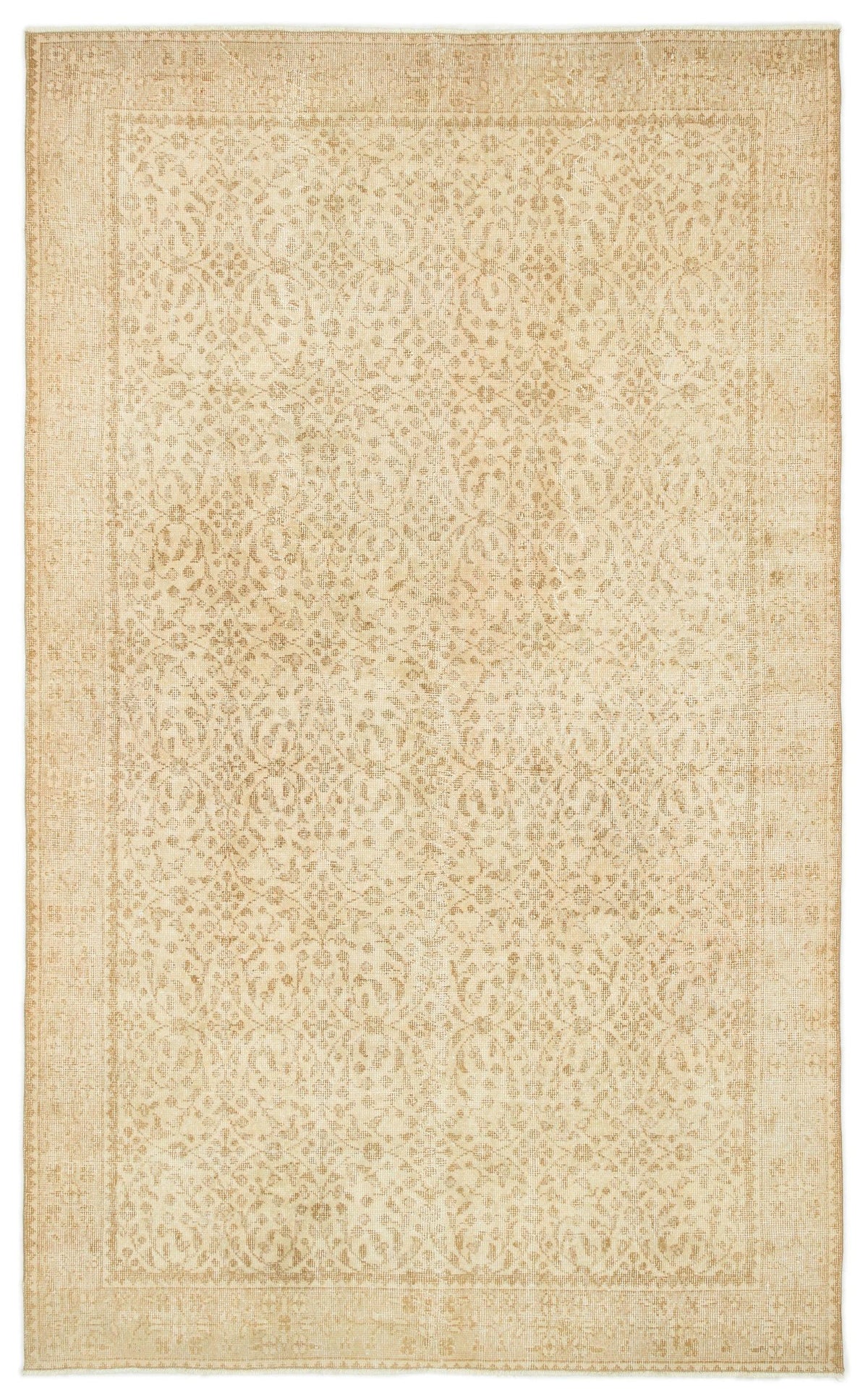 Beige and tan vintage-style rug with a faded, intricate floral medallion pattern and a decorative border.