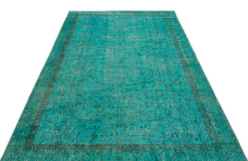Load image 1 in gallery view. Teal and black distressed traditional rug with an ornate floral medallion pattern on a white background.