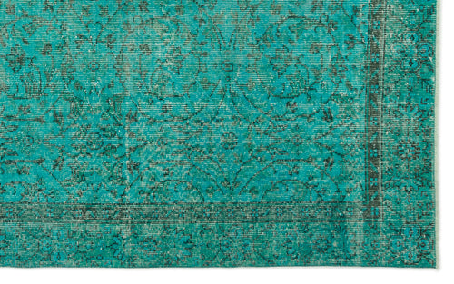Load image 1 in gallery view. Teal and black distressed rug with a traditional floral medallion pattern and a bordered edge.