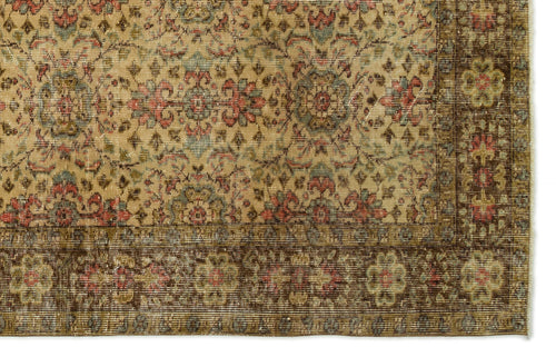 Load image 1 in gallery view. Tan traditional rug with a faded floral medallion pattern, intricate red and blue accents, and a dark brown border.