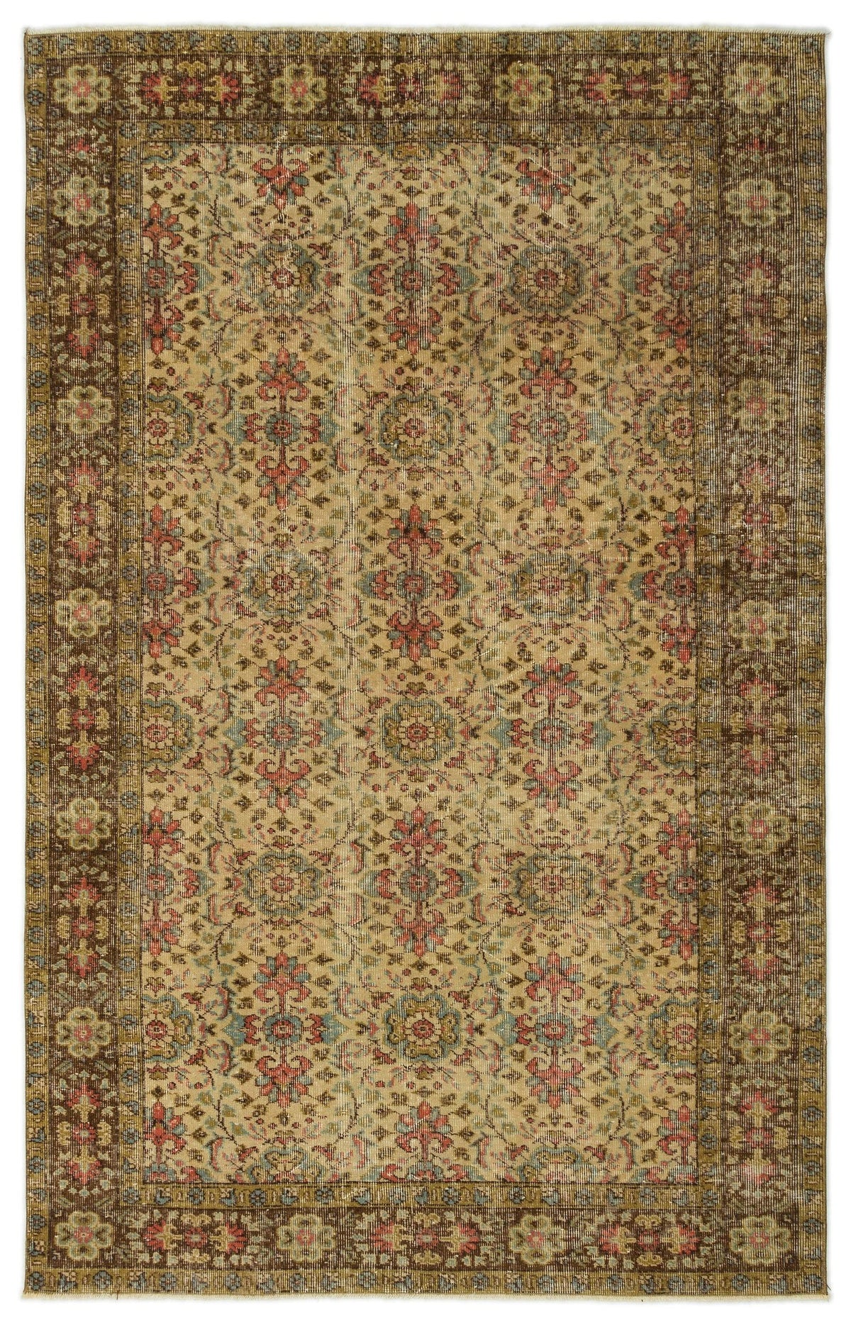Distressed beige rug with a repeating floral medallion pattern in muted red, blue, and brown, featuring a wide border.