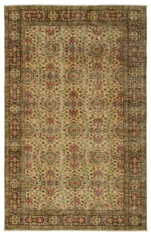 Load image 1 in gallery view. Distressed beige rug with a repeating floral medallion pattern in muted red, blue, and brown, featuring a wide border.