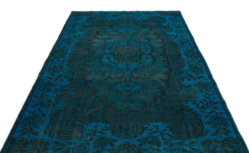 Load image 1 in gallery view. Deep blue and black distressed rug with a traditional ornate floral medallion pattern on a white background.