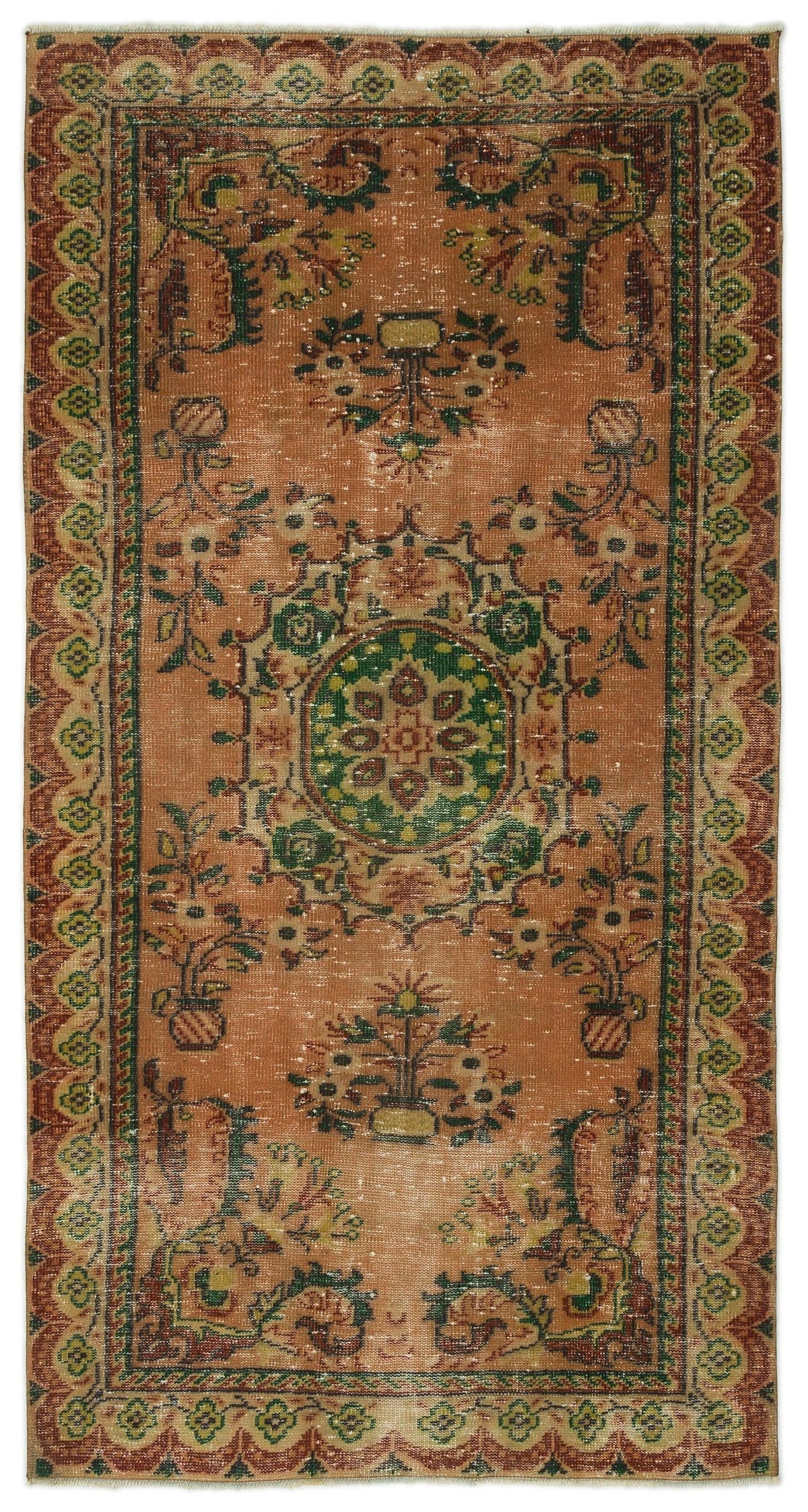 Terracotta vintage-style rug with a central green floral medallion, botanical motifs, and a decorative geometric border.