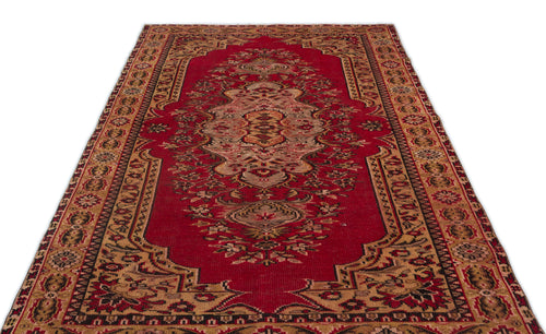 Load image 1 in gallery view. Red and tan traditional Persian-style rug with a central floral medallion and intricate geometric border.