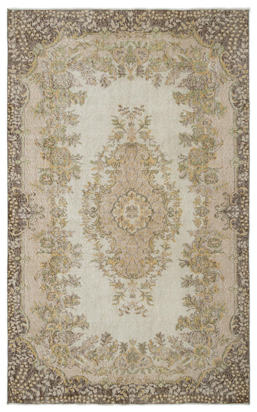 Load image 1 in gallery view. Distressed beige and brown traditional rug with a central floral medallion and ornate border on a white background.