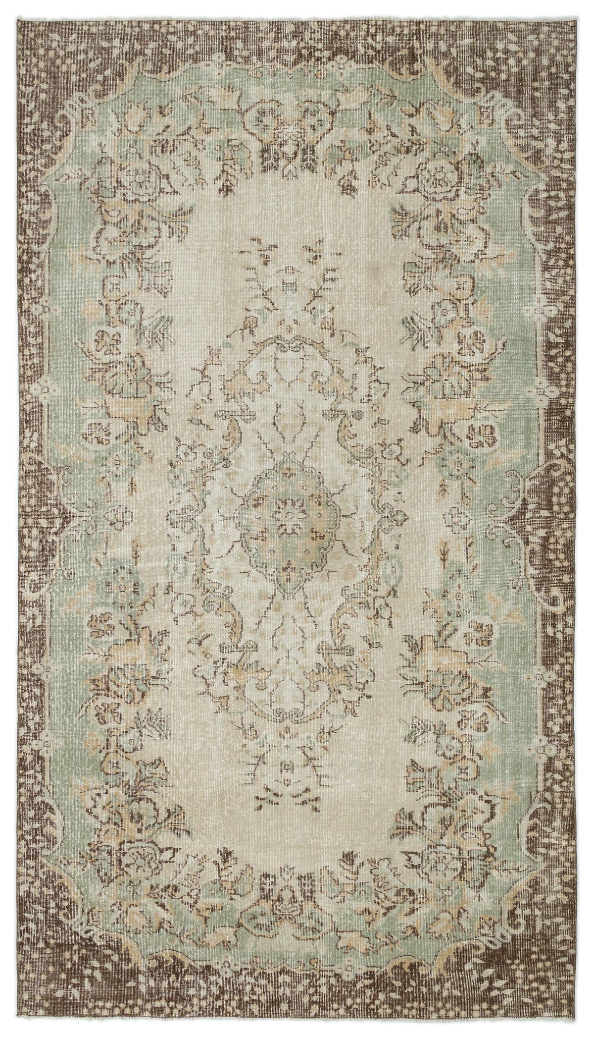 Distressed beige, sage green, and brown rug with a traditional floral medallion pattern and ornate border.