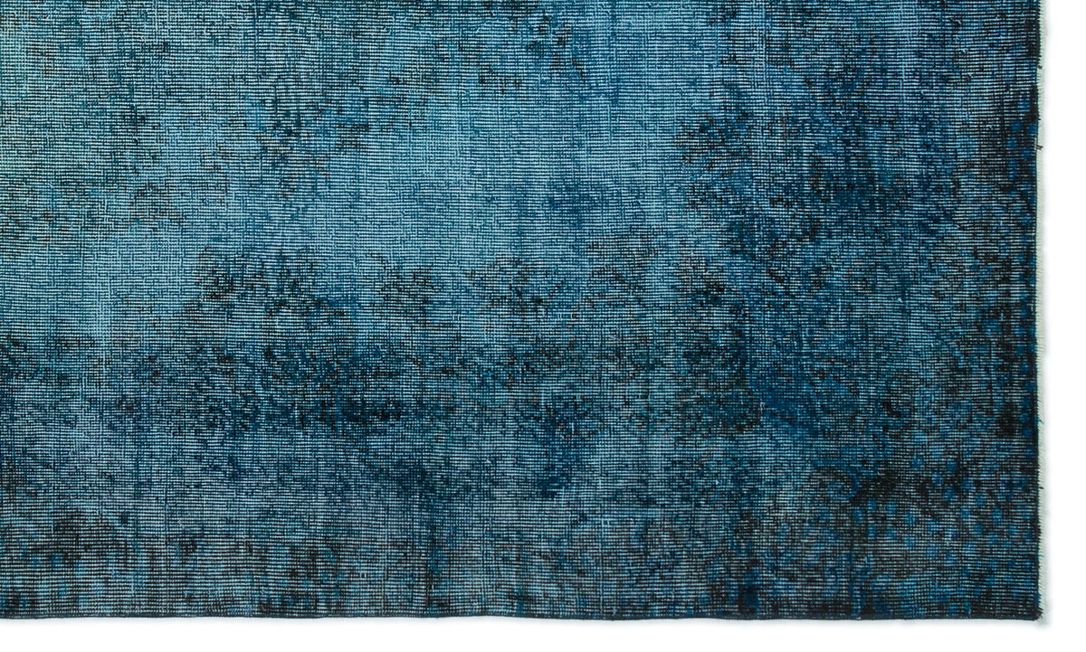 Deep blue and black distressed rug with a textured, mottled pattern on a white background.