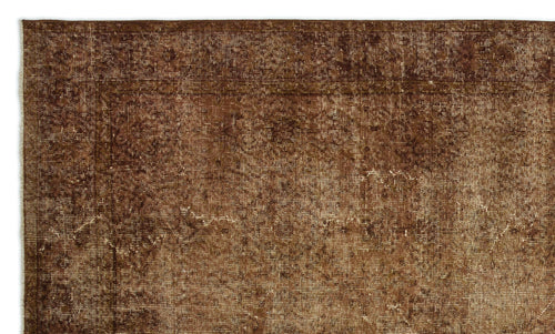Load image 1 in gallery view. Dark brown distressed rug with a faded traditional border and subtle, worn-in medallion pattern.