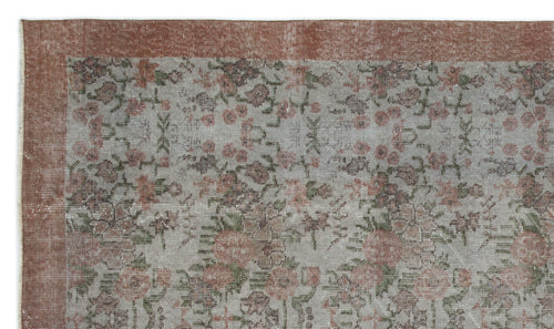 Load image 1 in gallery view. Distressed grey rug with a faded floral pattern and a wide terracotta border.
