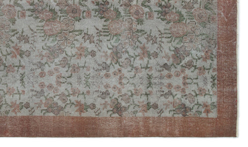 Load image 1 in gallery view. Distressed grey rug with a faded floral pattern in muted pink and green, featuring a solid terracotta border.