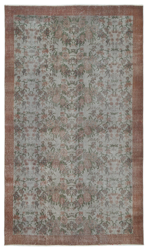 Load image 1 in gallery view. Distressed grey rug with a faded floral pattern and a wide terracotta border.