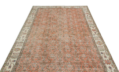 Load image 1 in gallery view. Terracotta and beige traditional rug with an all-over floral pattern and a wide decorative border.