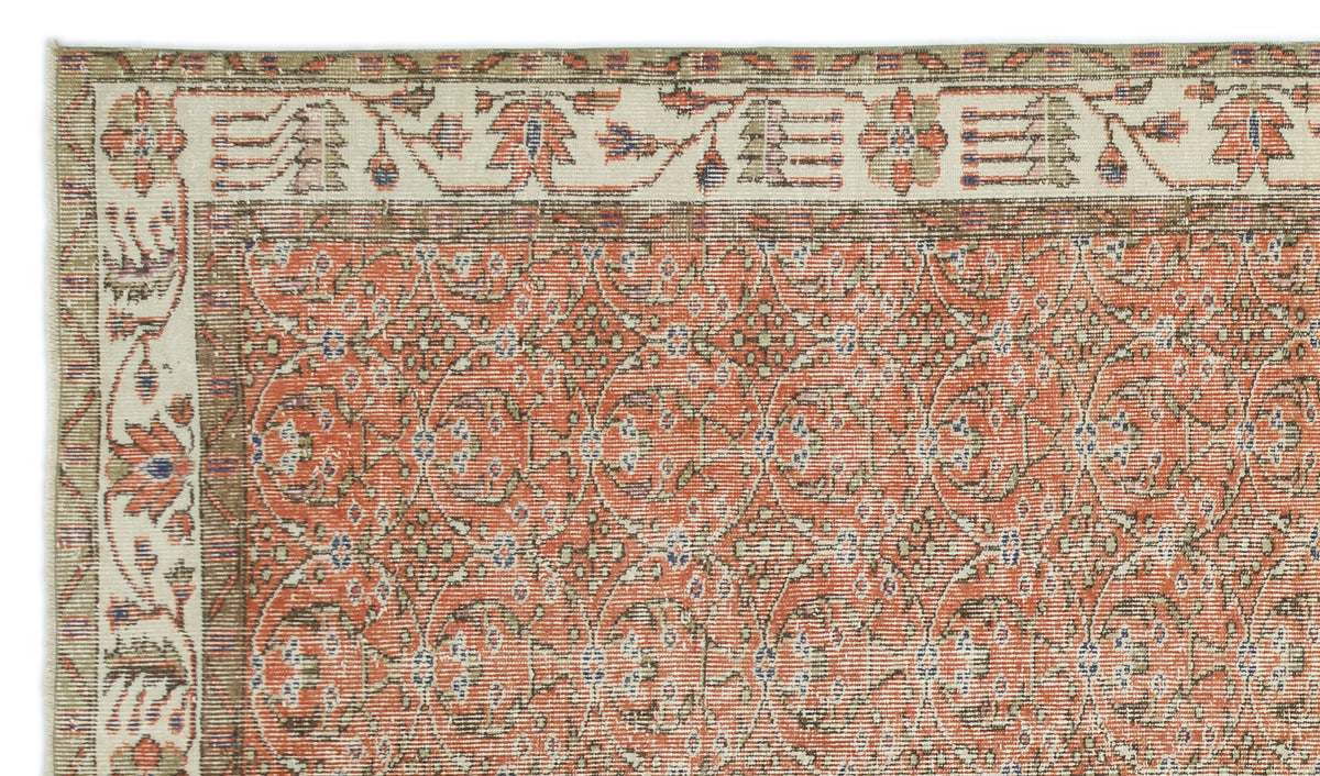 Terracotta and cream traditional rug with a repeating floral medallion pattern and a wide decorative border.