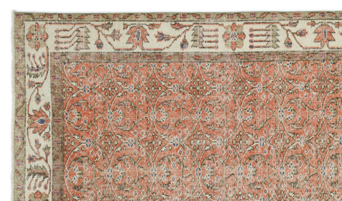 Load image 1 in gallery view. Terracotta and cream traditional rug with a repeating floral medallion pattern and a wide decorative border.