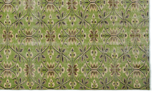 Load image 1 in gallery view. Bright green rug with a repeating beige and dark brown floral trellis pattern.