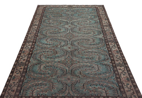 Load image 1 in gallery view. Teal and brown vintage-style rug with a repeating ornate floral medallion pattern and a decorative border.