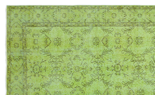 Load image 1 in gallery view. Chartreuse rug with a distressed brown floral medallion pattern and a decorative border.