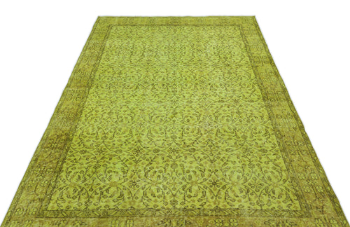 Load image 1 in gallery view. Chartreuse and olive green vintage-style rug with an intricate floral medallion pattern and a wide decorative border.