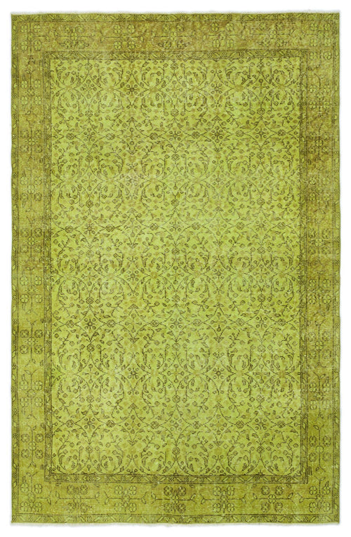 Load image 1 in gallery view. Chartreuse vintage-style rug with a distressed floral medallion pattern and a wide decorative border.