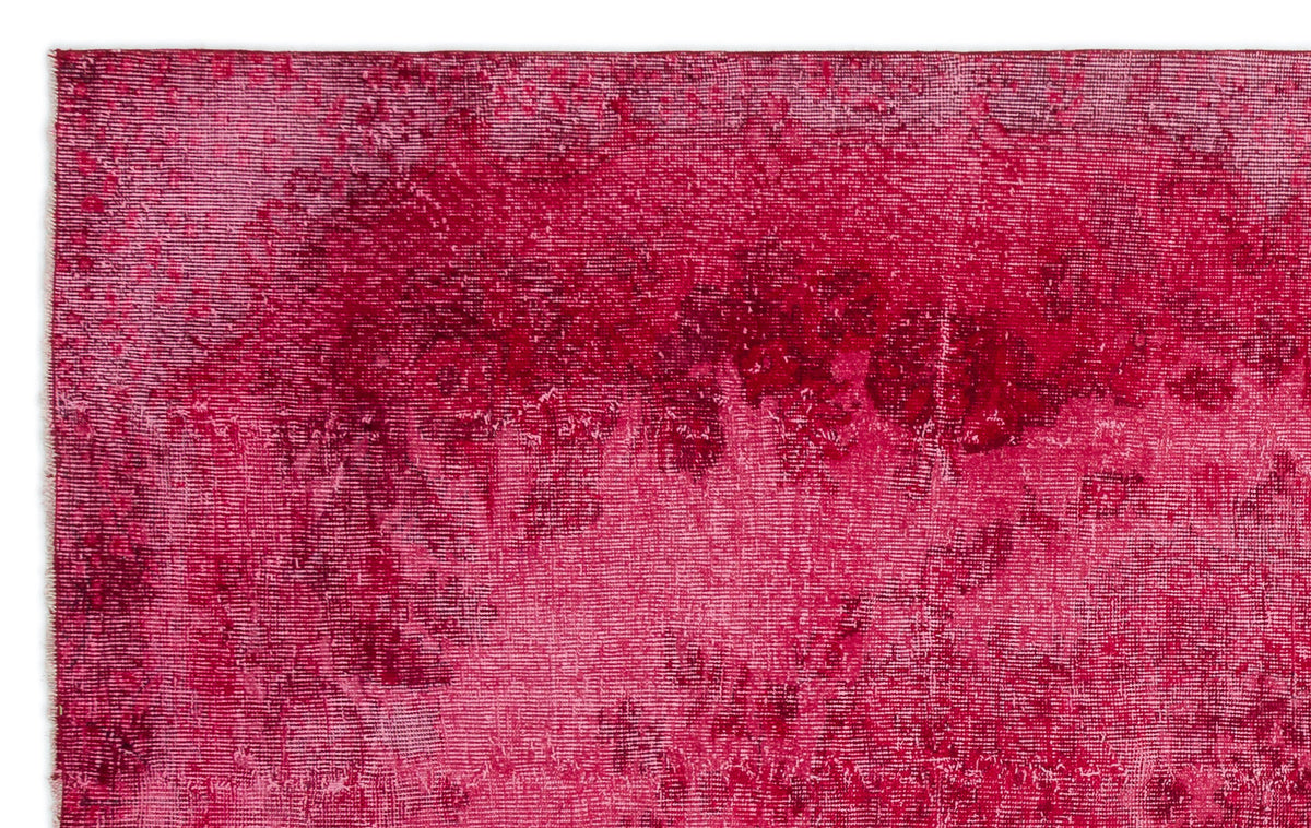 Magenta and deep red vintage-style rug with a distressed, overdyed texture.