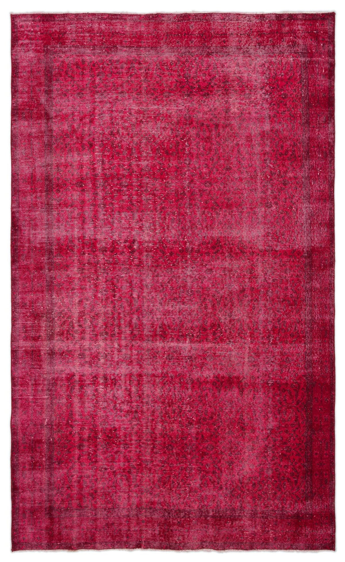 Magenta distressed vintage-style rug with a faded traditional border and central medallion pattern.