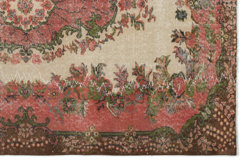 Load image 1 in gallery view. Distressed vintage-style rug with a cream field, red floral medallion, and dark brown border with visible white stitching.