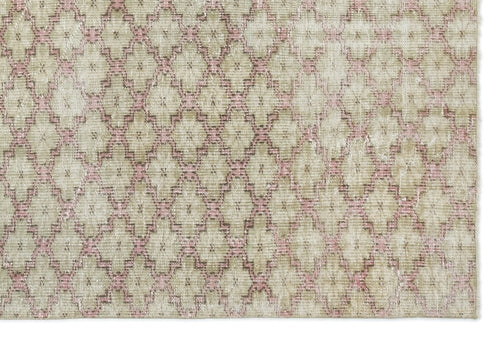 Load image 1 in gallery view. Beige and pink distressed rug with a repeating geometric diamond lattice pattern.