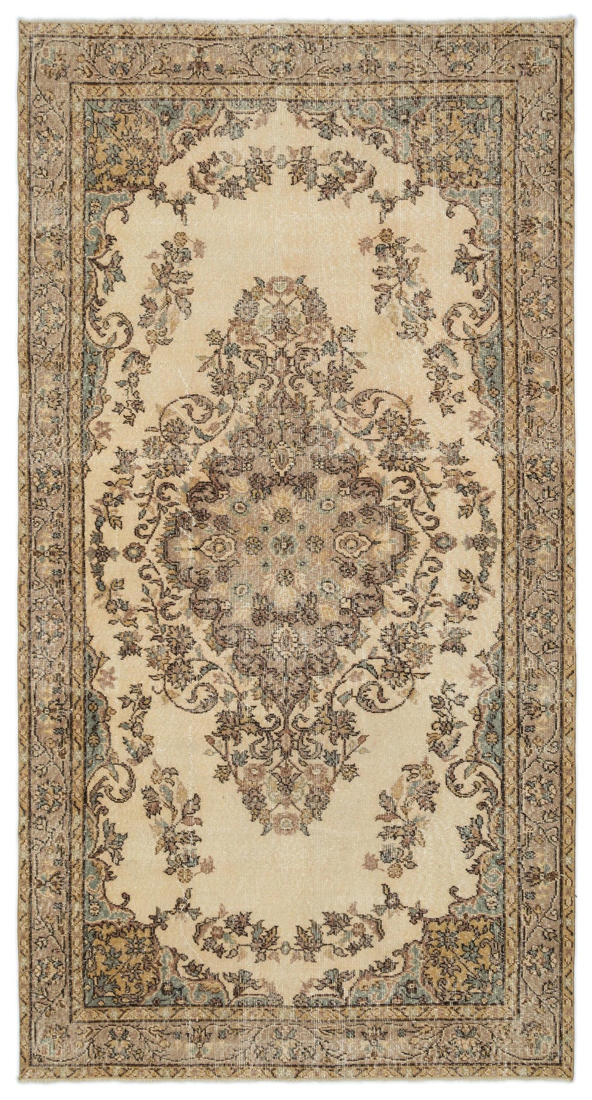 Beige traditional rug with a central floral medallion, intricate border, and distressed muted blue and brown accents.
