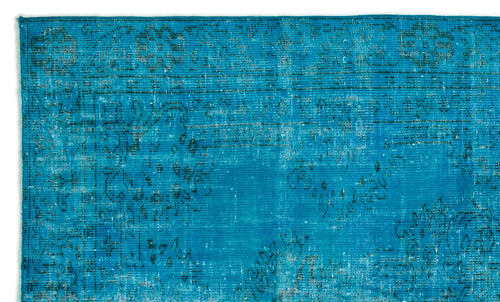 Load image 1 in gallery view. Bright turquoise rug with a distressed, faded traditional floral medallion pattern.
