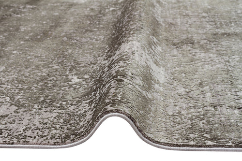 Load image 1 in gallery view. Grey and silver distressed area rug with a textured, abstract pattern and finished serged edges.
