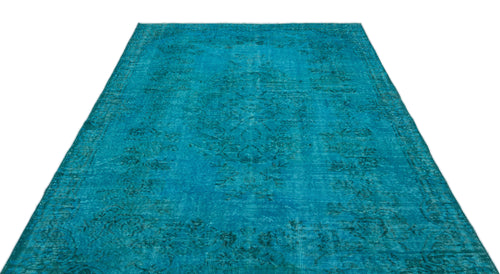 Load image 1 in gallery view. Teal distressed vintage-style rug with a faded traditional floral medallion pattern on a white background.