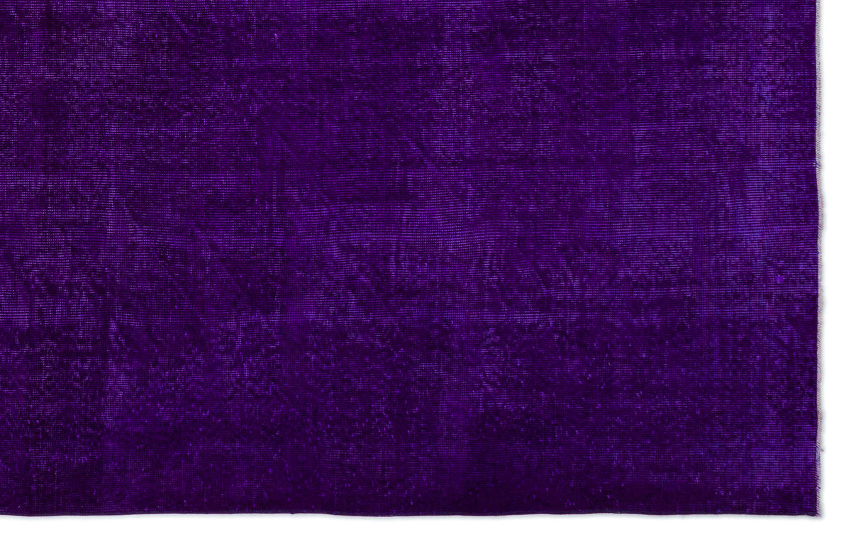 Solid deep purple rug with a subtle, distressed vintage texture.