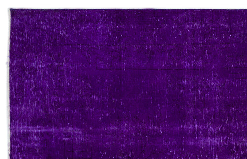 Load image 1 in gallery view. Deep purple vintage-style rug with a distressed, faded texture and subtle, worn-away traditional patterns.