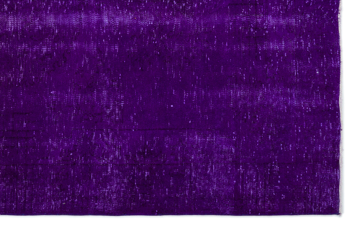 Deep purple vintage-style rug with a distressed, faded texture on a white background.
