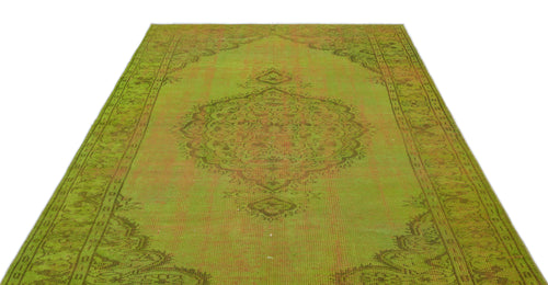 Load image 1 in gallery view. Chartreuse and olive green vintage-style rug with a central medallion and distressed traditional border pattern.