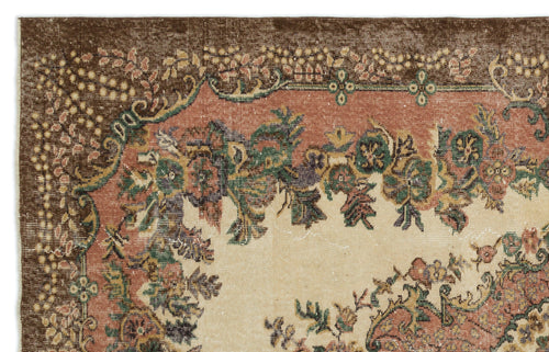 Load image 1 in gallery view. Vintage-style rug with a brown border, floral medallion pattern, and muted green, pink, and cream tones.