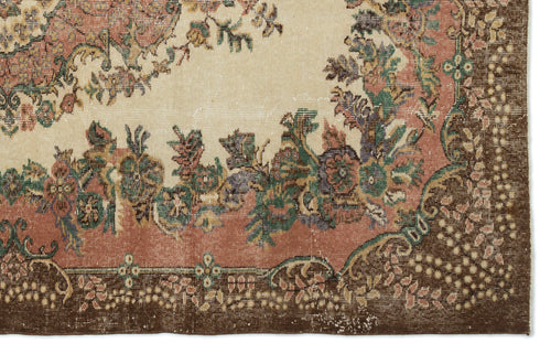 Load image 1 in gallery view. Vintage-style rug with a cream center, floral motifs in muted pink and green, and a wide dark brown border.