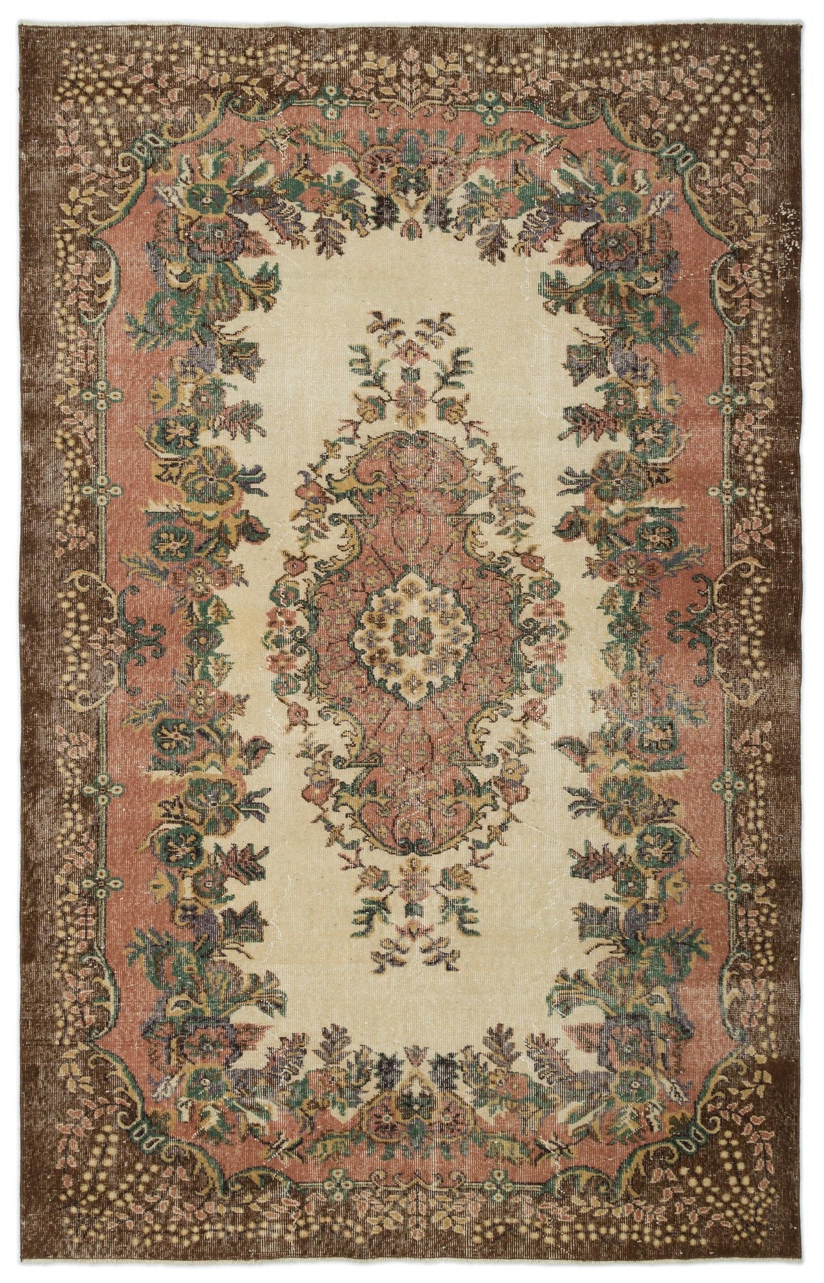 Distressed vintage-style rug with a central floral medallion and ornate border in cream, terracotta, brown, and green.