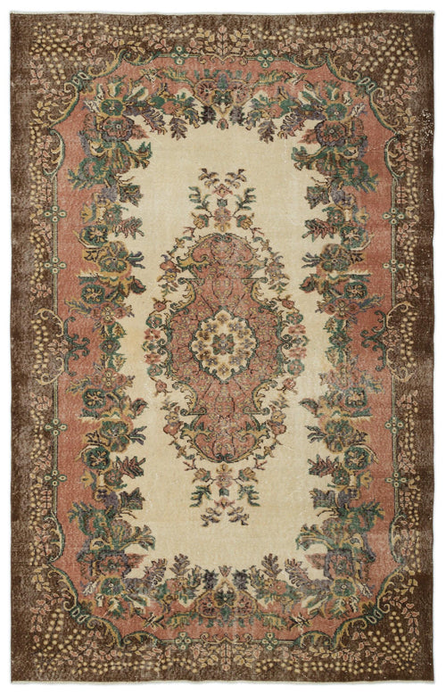 Load image 1 in gallery view. Distressed vintage-style rug with a central floral medallion and ornate border in cream, terracotta, brown, and green.