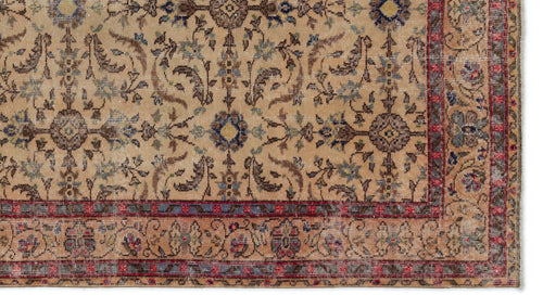Load image 1 in gallery view. Beige traditional rug with a distressed floral medallion pattern, accented by blue and red borders.