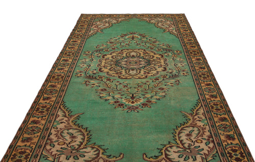 Load image 1 in gallery view. Emerald green traditional rug with a central floral medallion and ornate border in tan, brown, and cream.