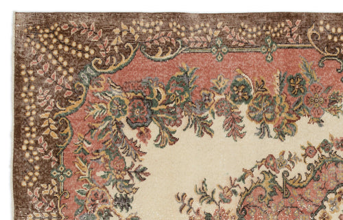 Load image 1 in gallery view. Vintage-style rug corner with a cream center, terracotta border, and intricate floral patterns in green and brown.