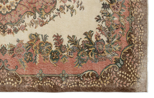 Load image 1 in gallery view. Cream, pink, and brown traditional rug with a floral medallion pattern and a detailed decorative border.