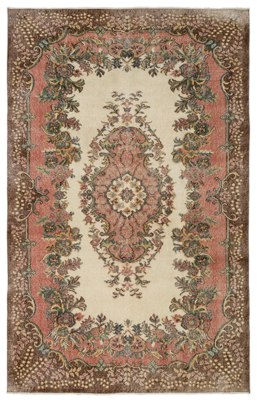 Load image 1 in gallery view. Cream, pink, and brown traditional rug with a central floral medallion and ornate botanical border.