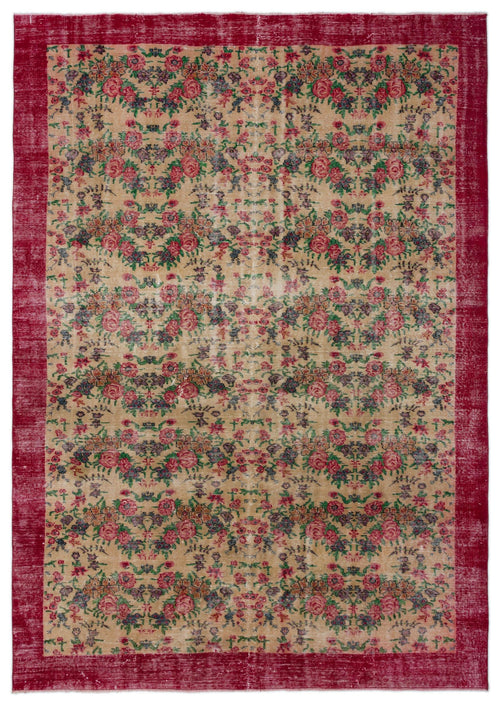 Load image 1 in gallery view. Distressed beige rug with a red border and an all-over floral pattern in red, green, and dark blue.